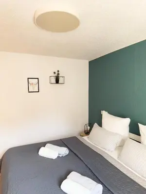 Ein Bett oder Betten in einem Zimmer der Unterkunft O&W Ferienhaus mit Pool nähe Nürburgring, Adenau