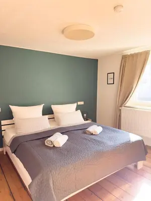 Ein Bett oder Betten in einem Zimmer der Unterkunft O&W Ferienhaus mit Pool nähe Nürburgring, Adenau