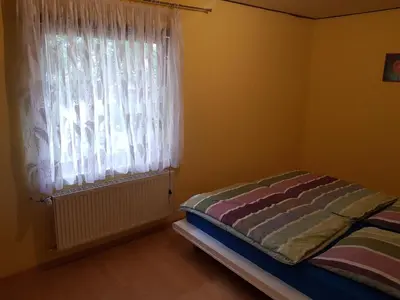 Ein Bett oder Betten in einem Zimmer der Unterkunft Ferienwohnung - a67931