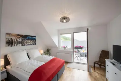 Ein Bett oder Betten in einem Zimmer der Unterkunft Ferienwohnung Burgblick Coraidelstein