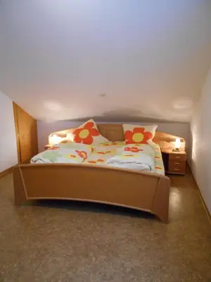 Ein Bett oder Betten in einem Zimmer der Unterkunft Wohnung Feuerberg mit Südbalkon