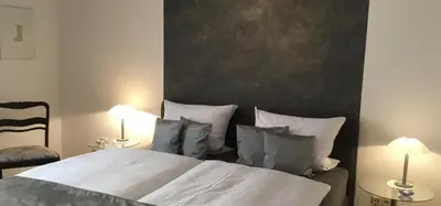 Ein Bett oder Betten in einem Zimmer der Unterkunft Komfort-Ferienwohnungen Walkmühle