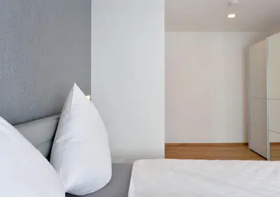 Ein Bett oder Betten in einem Zimmer der Unterkunft Ferienwohnungen Am Aller-liebsten
