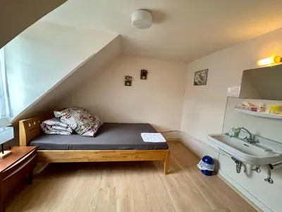 Ein Bett oder Betten in einem Zimmer der Unterkunft Goldner Stern Kaub