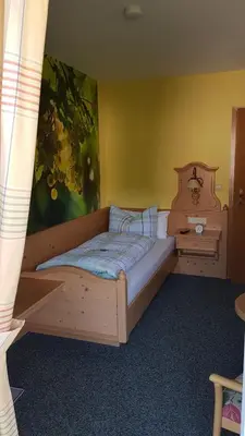 Ein Bett oder Betten in einem Zimmer der Unterkunft Brunnenhof
