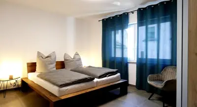 Ein Bett oder Betten in einem Zimmer der Unterkunft Moselufer Apartments
