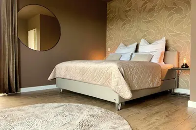Ein Bett oder Betten in einem Zimmer der Unterkunft LuxApart Eifel mit privater Sauna