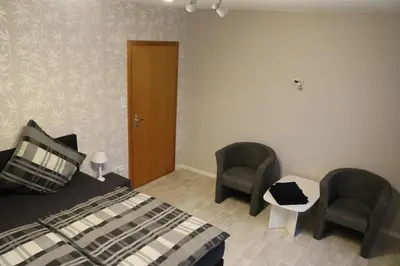 Ein Bett oder Betten in einem Zimmer der Unterkunft Gästehaus Rheinburgenblick