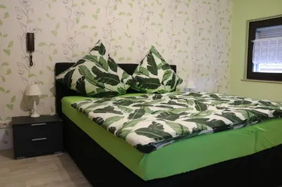 Ein Bett oder Betten in einem Zimmer der Unterkunft Gästehaus Rheinburgenblick