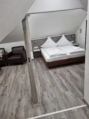 Ein Bett oder Betten in einem Zimmer der Unterkunft Ferienwohnungen KAMELIA