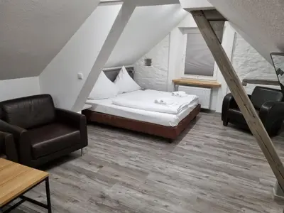 Ein Bett oder Betten in einem Zimmer der Unterkunft Ferienwohnungen KAMELIA