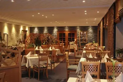 Ein Restaurant oder anderes Speiselokal in der Unterkunft Landhotel Lodge by Landhotel Krolik