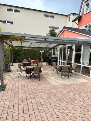 Ein Restaurant oder anderes Speiselokal in der Unterkunft Hotel Rosengarten