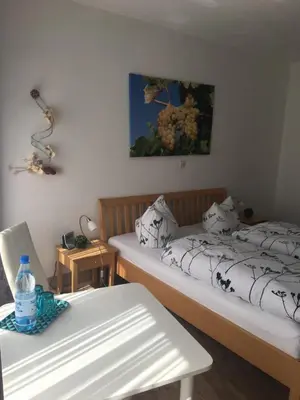 Ein Bett oder Betten in einem Zimmer der Unterkunft Pension 
