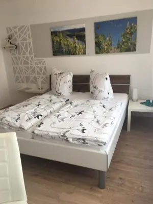Ein Bett oder Betten in einem Zimmer der Unterkunft Pension 
