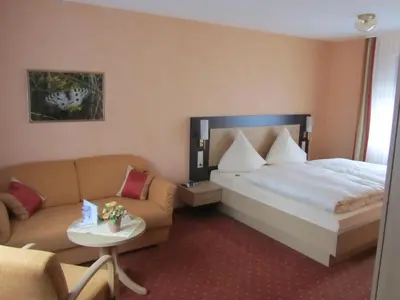 Ein Bett oder Betten in einem Zimmer der Unterkunft Weinhaus Berg
