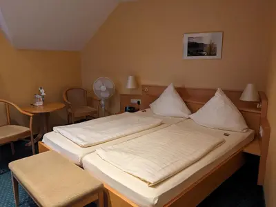 Ein Bett oder Betten in einem Zimmer der Unterkunft Weinhaus Berg