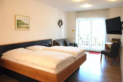 Ein Bett oder Betten in einem Zimmer der Unterkunft Ferienweingut Benedikt Nilles