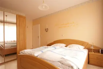 Ein Bett oder Betten in einem Zimmer der Unterkunft Ferienweingut Benedikt Nilles