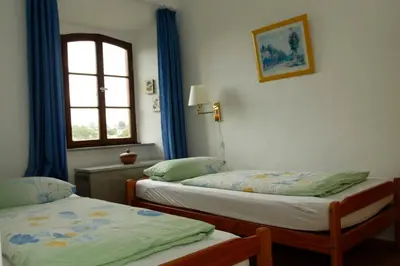 Ein Bett oder Betten in einem Zimmer der Unterkunft Kapelle - Urlaub auf dem Weingut