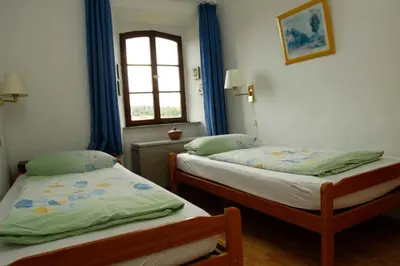 Ein Bett oder Betten in einem Zimmer der Unterkunft Kapelle - Urlaub auf dem Weingut