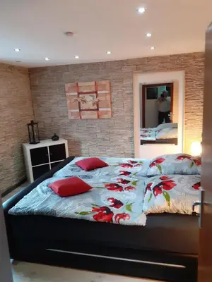 Ein Bett oder Betten in einem Zimmer der Unterkunft Im Vulkanland Fewo bis 6 Personen