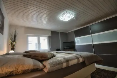Ein Bett oder Betten in einem Zimmer der Unterkunft Im Vulkanland Fewo bis 6 Personen