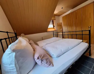 Ein Bett oder Betten in einem Zimmer der Unterkunft Ferienwohnung Herold