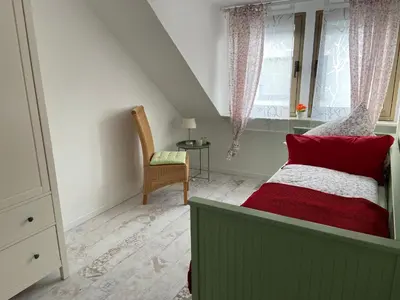 Ein Bett oder Betten in einem Zimmer der Unterkunft Haus Elsternest