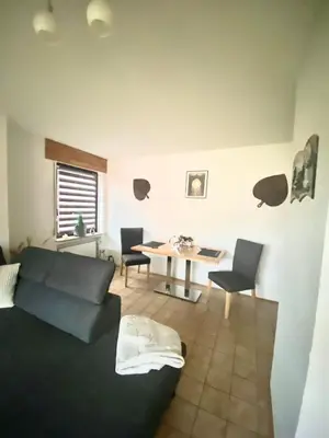 Ein Sitzbereich in der Unterkunft Ferienwohnung Zum König
