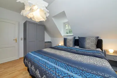 Ein Bett oder Betten in einem Zimmer der Unterkunft Ferienhaus alte Mühle