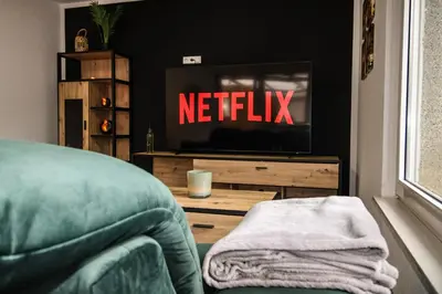 TV/Unterhaltungsangebot in der Unterkunft Chill Out Area, Sauna & Wirlpool, grandiose Aussicht, Smart TV, große Terasse, Zentrum nah