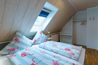 Ein Bett oder Betten in einem Zimmer der Unterkunft Ferienwohnung Bergblick