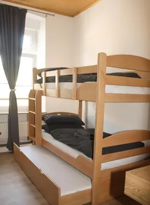 Ein Bett oder Betten in einem Zimmer der Unterkunft Gästehaus am Viehmarkt