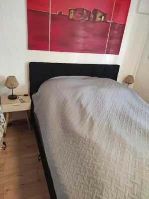 Ein Bett oder Betten in einem Zimmer der Unterkunft Wolfsschlucht