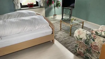 Ein Bett oder Betten in einem Zimmer der Unterkunft Gasthaus Hubertus