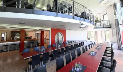 Ein Restaurant oder anderes Speiselokal in der Unterkunft Hotel und Kongresszentrum Wanderath