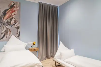 Ein Bett oder Betten in einem Zimmer der Unterkunft Design Apartment I Innenstadt I Küche I WIFI