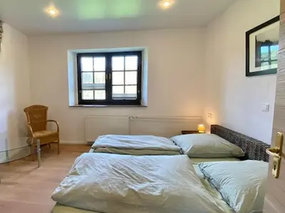Ein Bett oder Betten in einem Zimmer der Unterkunft Alte Mühle Börfink