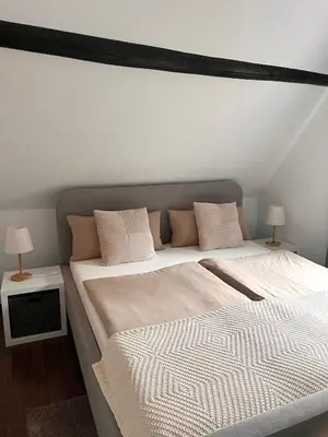 Ein Bett oder Betten in einem Zimmer der Unterkunft Ferienhaus Goldstück wohnen im Weinberg