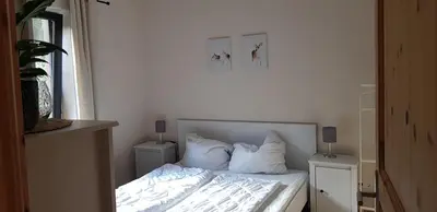 Ein Bett oder Betten in einem Zimmer der Unterkunft Neumühle Ferienwohnung 2