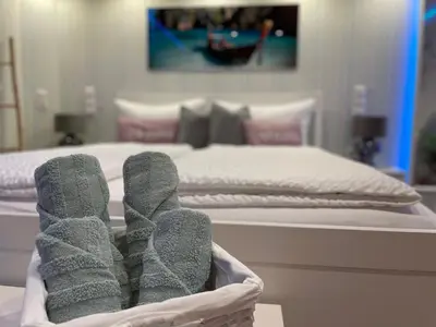 Ein Bett oder Betten in einem Zimmer der Unterkunft Moderne Ferienwohnung Zur Schlosshöhe