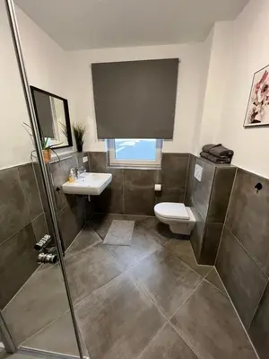 Ein Badezimmer in der Unterkunft ApartHotel Roxheim
