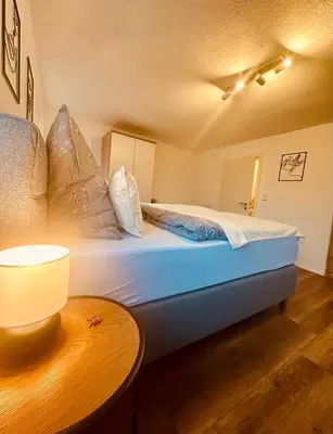 Ein Bett oder Betten in einem Zimmer der Unterkunft Ferienhaus Griede mit 3 Schlafzimmern