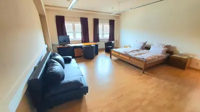 Ein Sitzbereich in der Unterkunft Ferienwohnung am Ring