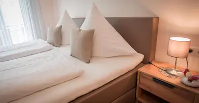 Ein Bett oder Betten in einem Zimmer der Unterkunft Weingut Erich Serwazi
