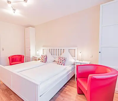 Ein Bett oder Betten in einem Zimmer der Unterkunft Johannishof Wein-Café & Gästehaus