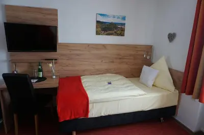 Ein Bett oder Betten in einem Zimmer der Unterkunft Hotel Jan van Werth