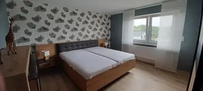 Ein Bett oder Betten in einem Zimmer der Unterkunft Ferienwohnung am Brohlbach