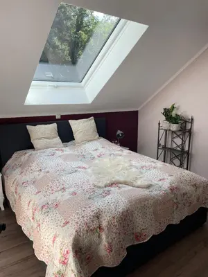 Ein Bett oder Betten in einem Zimmer der Unterkunft Neue Ferienwohnung im alten Forsthaus